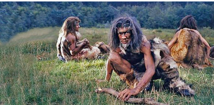 3 neanderthal sitting on grass